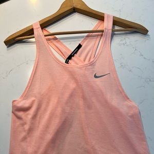 Nike tank top- open back. Never been worn, tags removed.